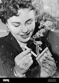 Lighting cigarette Black and White Stock Photos & Images