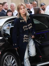 BTS member Jimin (@j.m) attends the Dior (@dior) Men's Spring/Summer 2027  show at Paris Fashion Week wearing a long velvet coat and denims. Image  credits: @gettyimages #VogueFashion