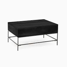 It incorporates the top with rattan legs for a new twist to a rustic favorite. Industrial Storage Pop Up Coffee Table