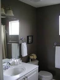 The bathroom chooses the dark shade of grey that appears from the bathroom wall and the bathroom tub. Dark Gray Taupe Paint Dark Gray Bathroom Grey Bathrooms Small Grey Bathrooms
