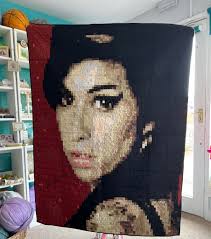 Gorgeous handmade quilt by the garbage bins