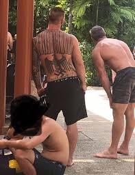 The number '109' is inked across de minaur's chest to signify that he is the 109th player to compete in the davis cup for australia. Tourist Allegedly Spotted Flaunting His Neo Nazi Tattoos In Sentosa