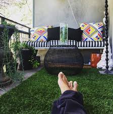 Artificial grass that could weather the harshest sun or torrential rain.providing you with year round green and turf enjoyment, perfect for all indoor and outdoor projects. This Tiny Astro Turf And Pillow Covered Balcony Outdoor Balcony Astro Turf Fake Grass Balcony