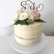 Birthday cakes are often layer cakes with frosting served with small lit candles on top representing the celebrant's age. Seminaked Cake Rustic Birthday Sixty Rose Gold Fresh Flowers White Mud Cake Ganache Pinterest Topper Coco 70th Birthday Cake Birthday Cake For Mom Mom Cake