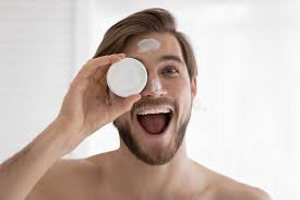 Head Shot Portrait Funny Young Man Holding Face Cream Jar Stock Image