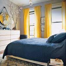 Grey wooden floors, light chiffon curtaining and low furniture show elegance. I Particularly Like These Yellow Curtains Decor Grey Bedroom Design Yellow Room Blue Bedroom