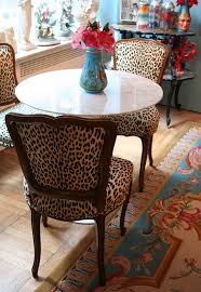Explore more like zebra print dining room chair. Dixie S Sleek White Kitchen With Closeted Colorful Charm Printed Chair Animal Print Decor Dining Room Chairs