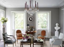 Contemporary living room with inset niche walls and a stunning tray ceiling lined with dark wood beams. Gray Bedroom Living Room Paint Color Ideas Architectural Digest