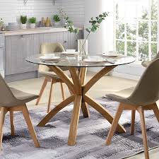 Risk of shatter associated with glass furniture. Lugano Round Glass Top Solid Oak Legs Dining Table Shop Designer Home Furnishings