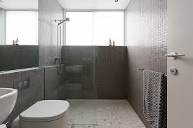 This small walk in shower no door look spacious with half glass shower wall and glass tile shower floor. What Are Alternatives To Glass Shower Doors