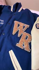 Rhinestoned this gorgeous jacket, for Varsity cheerleader Mackenzie, from  West Ranch High School. I absolutely love the way the gold stones shine on  the navy blue jacket. It’s such a great contrast. ...