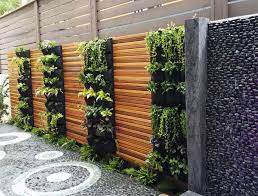 A garden retaining wall is an effective way to prevent soil erosion, and it can be a decorative feature. Delectable Garden Cloth 12 Pocket Hanging Vertical Garden Wall Planter For Yard Garden Home Decoration Amazon Ae Patio Lawn Garden