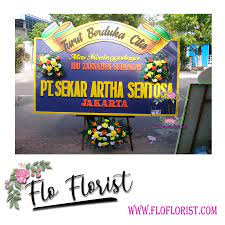 Pesan bunga papan duka cita di toko bunga karanganbunga.com, kami kirimkan hari ini juga. Toko Bunga Banjarmasin Flo Florist