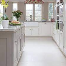 This paired with solid vibrant colours or natural wood finishes can either swing towards modern country style or elegant city living, it just depends on what kitchen appliances and units are chosen to be used i.e. Pale Grey And White Traditional Kitchen Kitchen Decorating Ideal Home Taupe Kitchen Kitchen Remodel Kitchen Inspirations