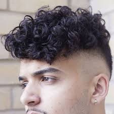 In terms of short curly hair cuts, the short haircuts in front and longer behind are the choice of hairstylists like pierre ginsburg, but there are also short cuts with less scaled curly hair, thought to soften the marked features and the line of the cheekbones. Androgynous Masculine Leaning Coded Hairstyles For Wavy Hair Qwear Queer Fashion Platform