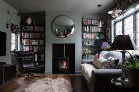 Tv Room Snug With Grey Sofa Black Shelving Dark Parquet Wooden Floor Round Mirror Gas Effect Wood Burning Stov Snug Room Cosy Living Room Interior Design