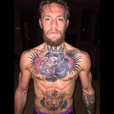 He has a gorilla and a tiger on his torso (image: Conor Mcgregor Chest Tattoo Is Badass Chest Tattoo Fighting Tattoo Conor Mcgregor Tattoo