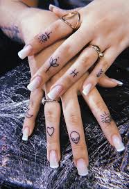 45 Meaningful Tiny Finger Tattoo Ideas Every Woman Eager To Paint Latest Fashion Trends For Woman Small Finger Tattoos Tiny Finger Tattoos Small Hand Tattoos