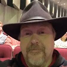 What is the bird doing at the feeder?