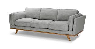 It is still really warm, looks beautiful next to grey, but is a little more muted. Timber Pebble Gray Sofa Article