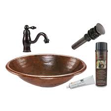 oval copper sink with faucet and drain