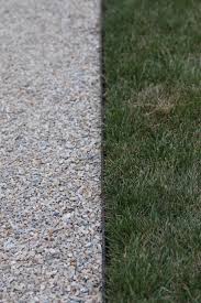 Your asphalt driveway edge maintenance may differ from your neighbors, but they're all equally as important. Tar Chip Driveway With Steel Edge Https Www Ajtla Com Navesink River Road Gravel Driveway Driveway Edging Gravel Driveway Edging