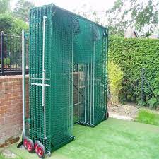 Innovative Space Saving Batting Cage Features A Unique Roll Away Design For When The Cage Is Not In Use Backyard Baseball Batting Cage Backyard Batting Cages