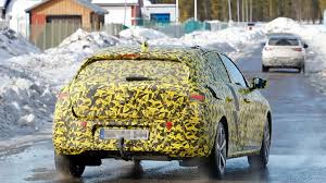 На кормі зробили великий напис з назвою моделі. New Spain Photos Of The Opel Astra 2022 Rolling During The Winter Tests Archytele