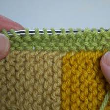 In knitting, picking up stitches means adding stitches to the knitting needle that were previously bound off or belong to the selvage. Illitilli Picking Up From A Garter Selvedge