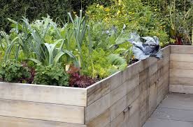 We used pressure treated 2×6's for the sides and 4×4's for the corners with some treated deck raised planter boxes on wheels / casters. How To Build A Raised Garden Bed Diy Container Garden