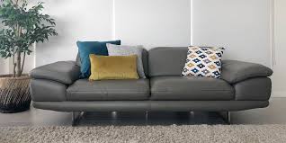 Choose a calm yellow shade if you aren't ready to rock super bold colors. Grey Sofa With Yellow And Blue Cushions