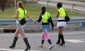 Spanish prostitutes wear yellow bibs to ...