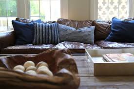 Black And White Pillows On Brown Leather Couch The Right Pillows For A Leather Sofa Leather Couches Living Room Brown Leather Couch Brown Leather Couch Living Room