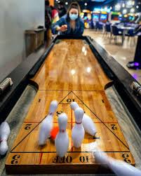 * each player shoots two shuffleboard weights at the pins, just like bowling. Cidercade Houston Why Play Shuffleboard When You Can Play Shuffleboard Bowling And 275 Other Games Goodquestion Facebook