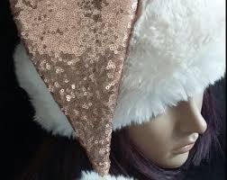 The sequin red & white chevron santa hat features a modern red and white chevron pattern with a white whether you're cuddling up in front of the fire or heading out to celebrate the season, this sequin santa hat is sure to catch a few compliments. Rose Gold Sequin Santa Hat Limited Edition Can Be Found At Www Etsy Com Shop Originalsbyeva Rose Gold Sequin Santa Hat Unique Jewelry