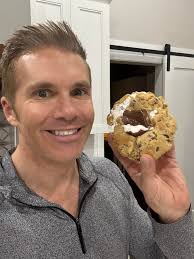 MORE BAKING I'm working out a new recipe for S'mores cookies. It has  marshmallow fluff, Hershey's bar, crushed graham crackers in the dough &  whole