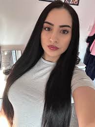 Can someone remove stray hairs from my back in this photo?