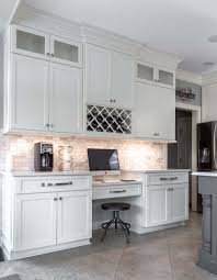 More dramatic shades of matt grey create instant impact, while the metallic shine of chrome and steel creates a clean, modern aesthetic. Cream Kitchen With Gray Island Lewis Custom Cabinets