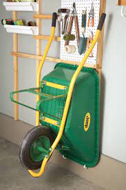 12 Tips For Diy Garage Organization Garage Storage Garage Storage Solutions Wheelbarrow Storage