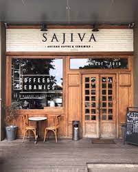Experience and dive into the world of specialty coffees. Marbled Tables Wooden Chairs Comfy Sofas And Brick Walls My Kind Of Coffeeshop I Can Enjoy T Coffee Shops Interior Cafe Interior Design Storefront Design