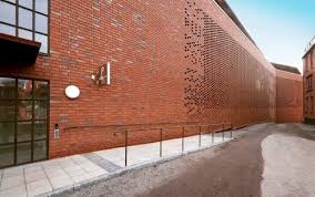 A Car Park Plays Hide And Seek Parking Design Car Parking Brick Facade