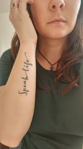 Speak Life Tattoo Woman S Small Tattoo Woman S Script Tattoo Arm Placement Tattoo Script Tattoo Tattoo Script Life Tattoos Arm Tattoo