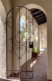 Spanish furniture, wrought iron and sculptures. Spanish Style Gates Exterior Mediterranean With Spanish Traditional Doorbell Wrought Iron Doors Front Entrances Wrought Iron Security Doors Iron Security Doors