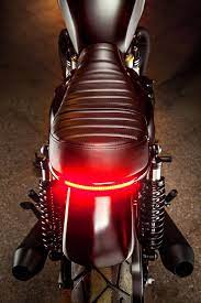 In Our Review Of The New Model Triumph T100 We Argued That It Was In Many Respects The Better Bike Triumph Bonneville T120 Triumph Bonneville Cafe Racer Seat