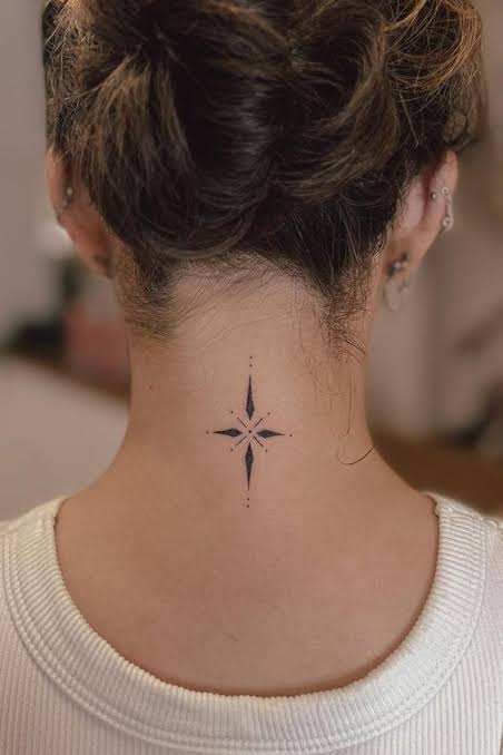 Simple cross tattoo on back | Star on neck tattoo, Neck tattoos for women, Female neck tattoos