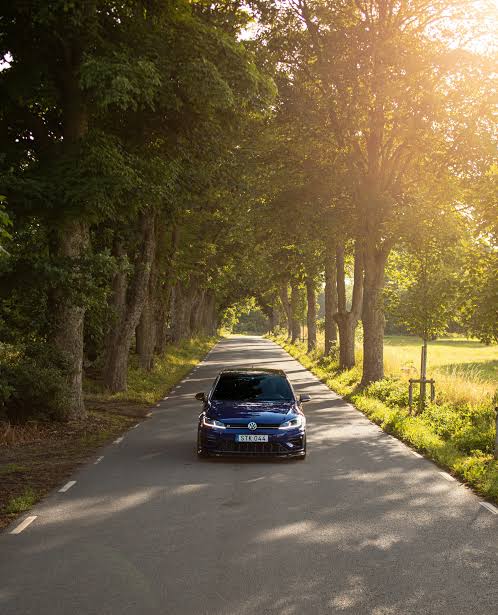 Car driving on a winding rural road