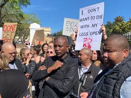 According to reports, the protest was sparked by the court appearance of residents arrested in connection with vigilante killings. One Voice At The Cape Town Protest No More No F K