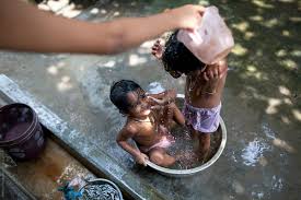 Collection by the splash baby. Twin Girls Bathing And Making Fun In A Small Bathtub By Dream Lover Stocksy United