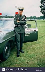 Download This Stock Image A Us Army Military Policeman Stands By With A Patrol Car Jgf1tj From Alamy S Library Of Milli In 2020 Military Policemen Us Army Army Day