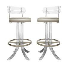 Think mink, velvet and leather for a luxe look, or scale it back at more casual gatherings with rattan and acrylic. Pair Of Sculptural Swivel Bar Stools In Lucite 1970s Sold Lobel Modern Nyc